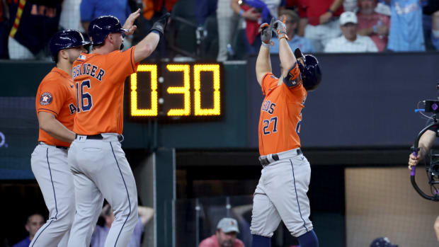Jose Altuve celebrates his ALCS Game 5 home run against the Rangers with his Astros teammates.